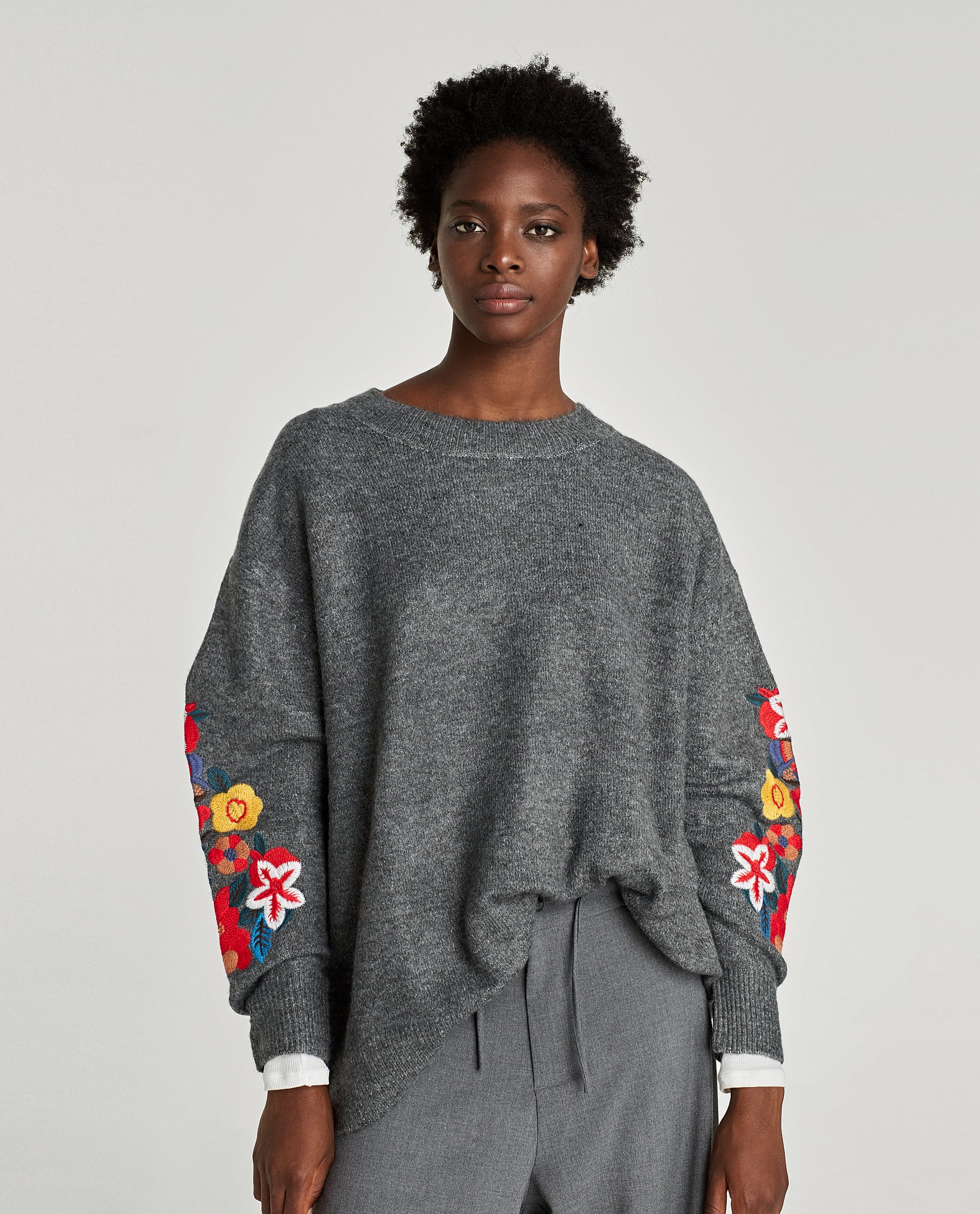 EMBROIDERED OVERSIZED SWEATER WITH CUFF DETAIL