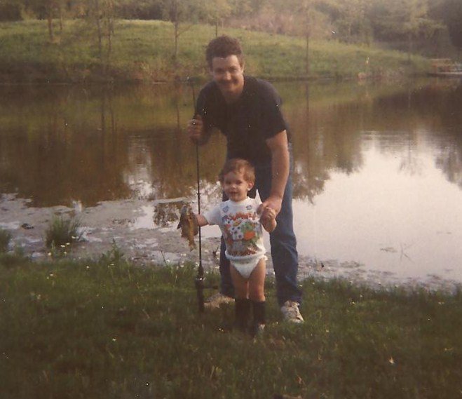 Dad teaching Ricky to fish